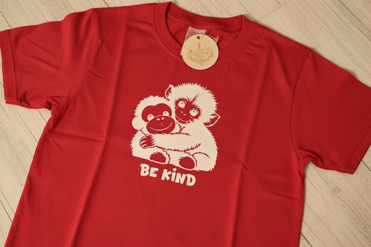 kids short sleeve tshirt with punch the monkey design in white htv with be kind logo