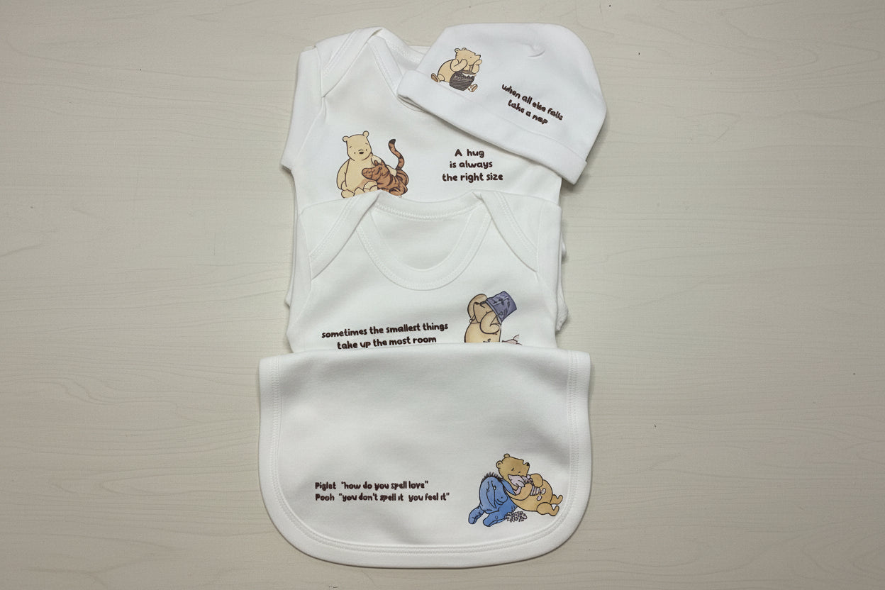 winnie the pooh 100% cotton neutral basics set including vest, romper, beanie and bib